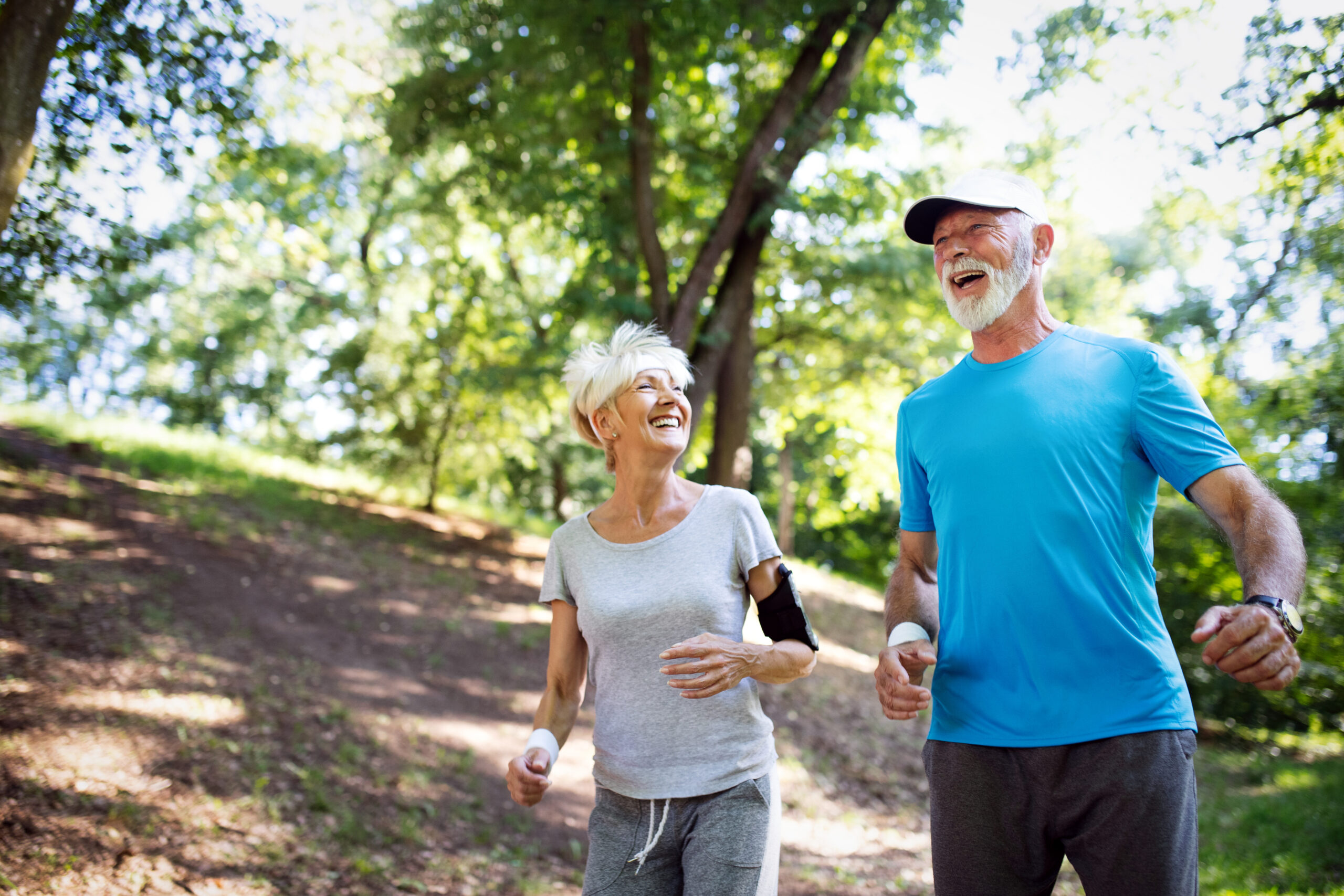 Happy healthy mature couple exercising